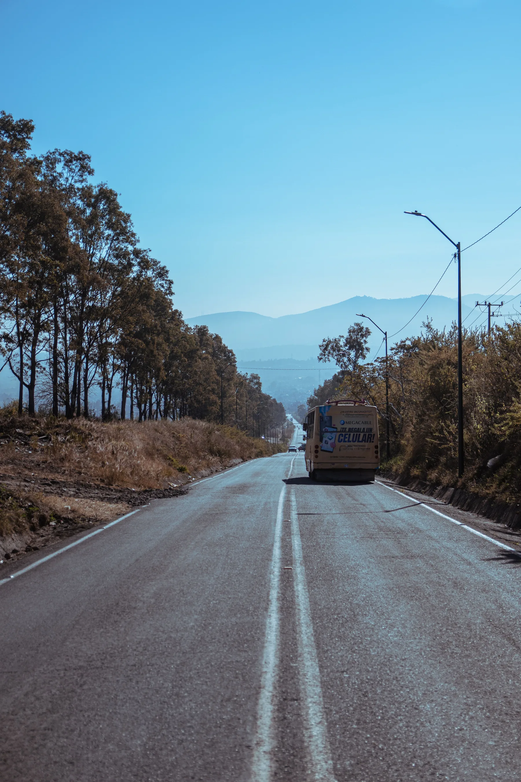 Representative group bus travelling on an open road