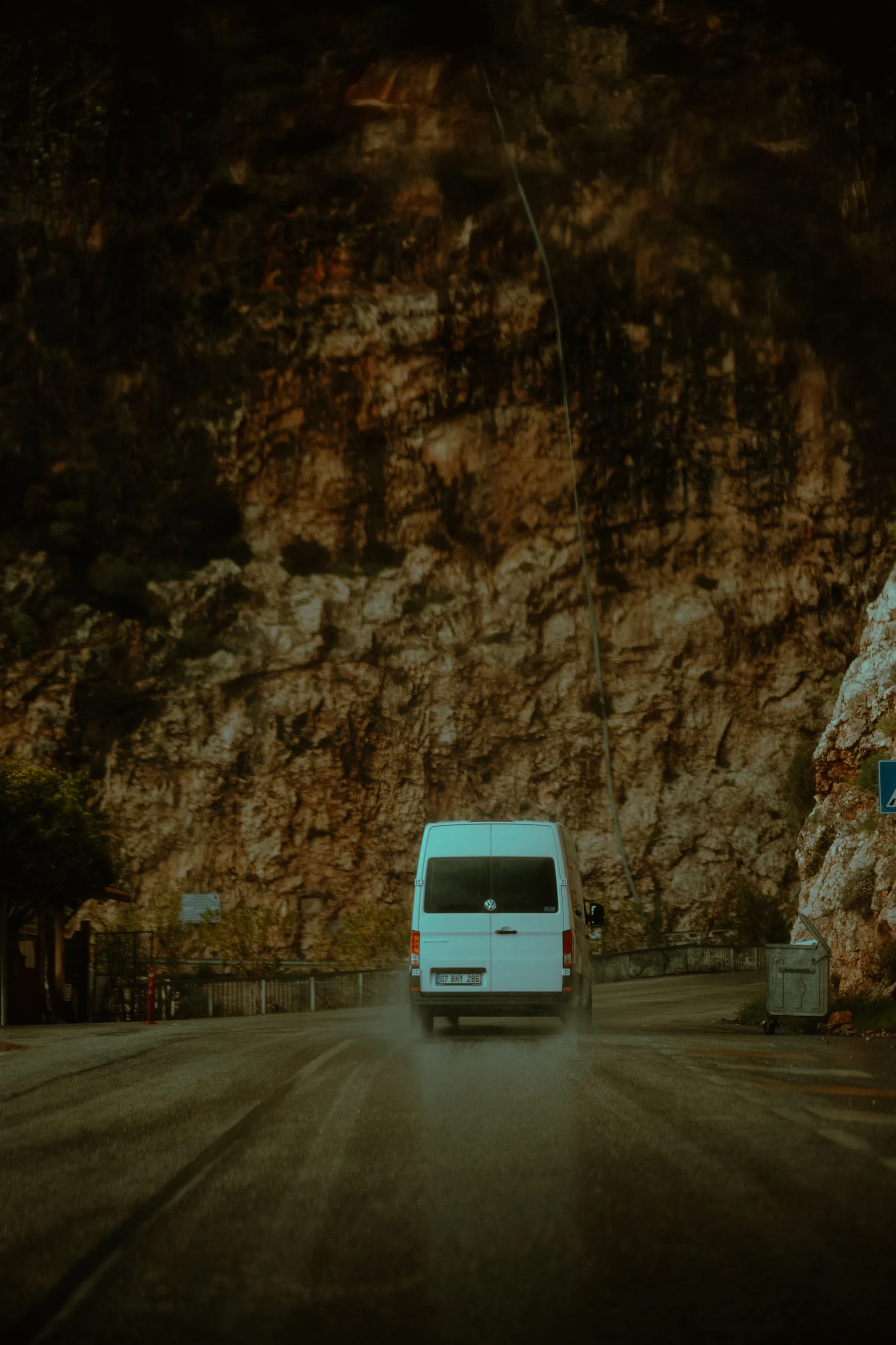 Representative passenger minivan travelling on a mountain road