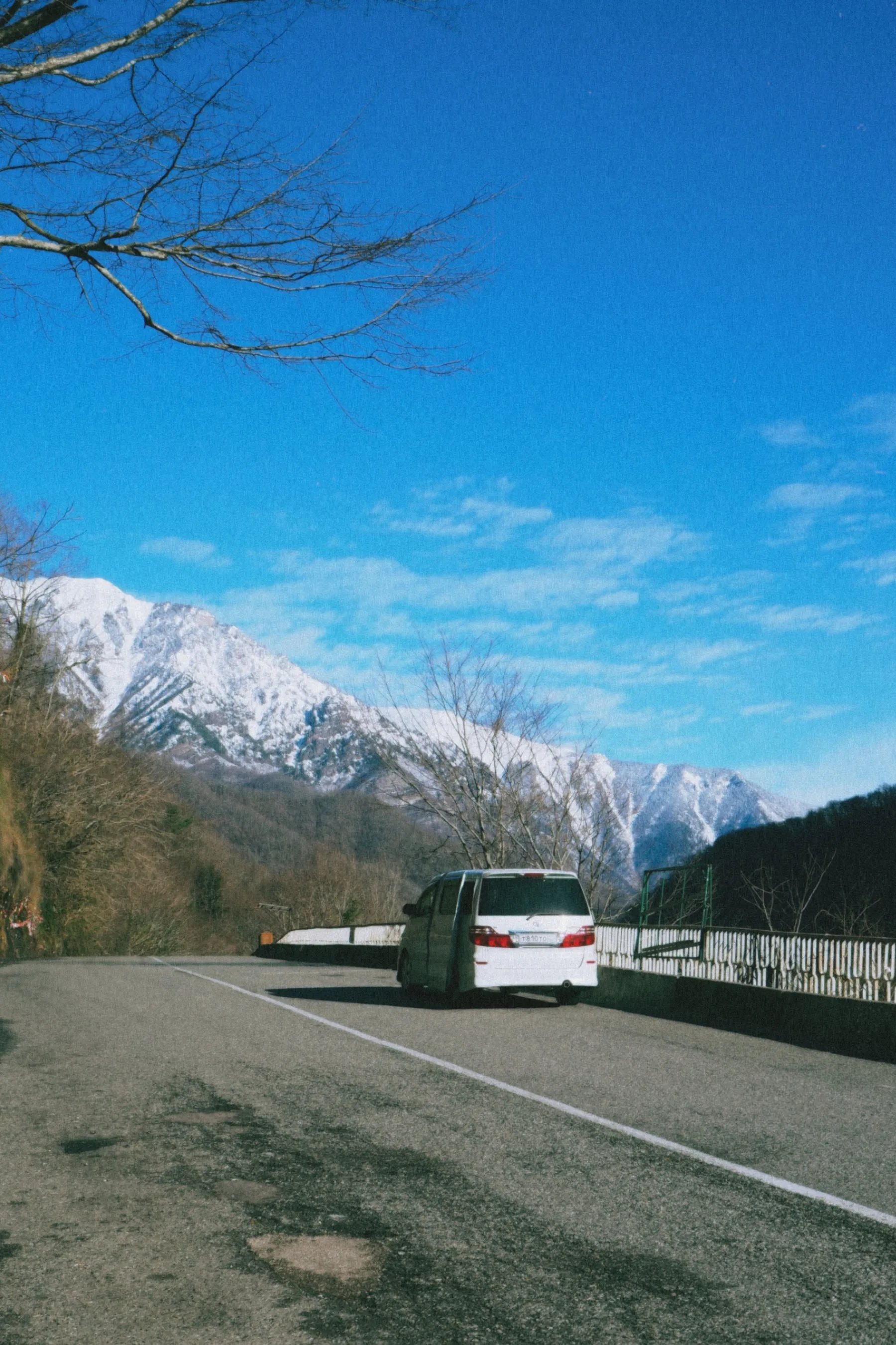 Representative premium passenger van on a scenic road